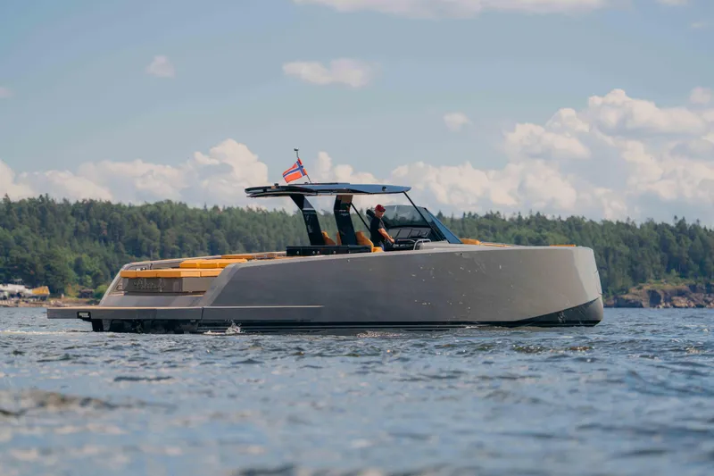  Yacht Photos Pics 2024 Pardo Yachts P43 cruising on a scenic lake with forested shoreline.