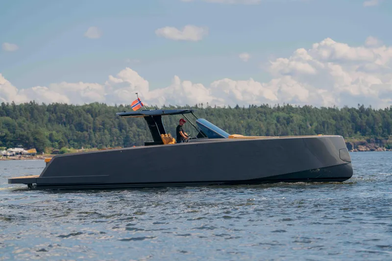  Yacht Photos Pics 2024 Pardo Yachts P43 cruising on a serene lake with forested shoreline.