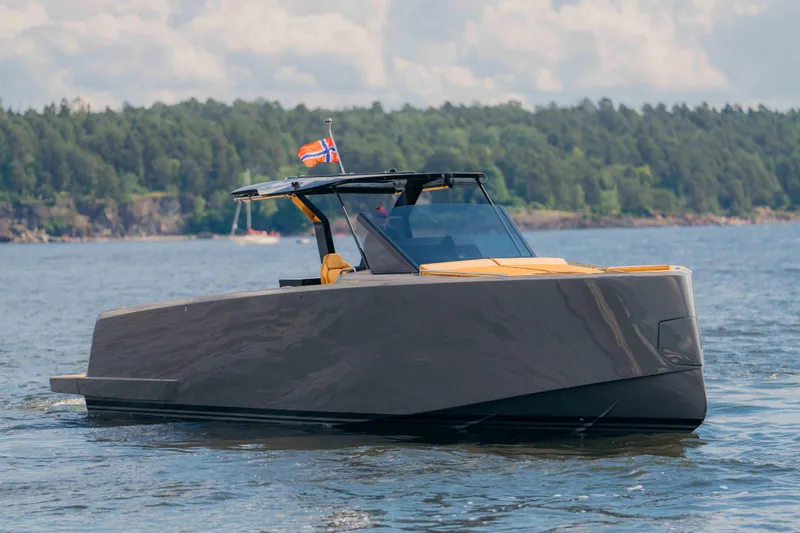  Yacht Photos Pics 2024 Pardo Yachts P43 cruising on a serene lake with forested shoreline.