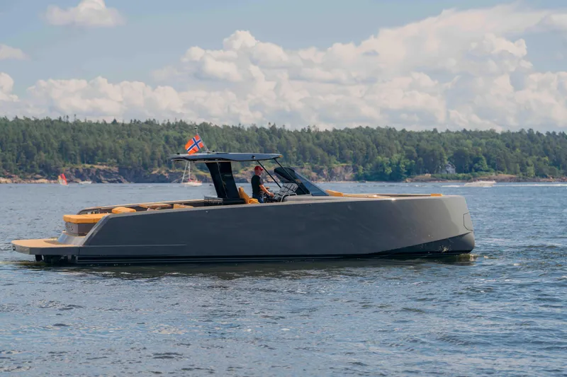  Yacht Photos Pics 2024 Pardo Yachts P43 cruising on a scenic lake with forested shoreline.