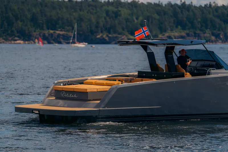  Yacht Photos Pics 2024 Pardo Yachts P43 cruising on a scenic lake with lush forested background.