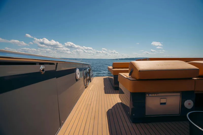  Yacht Photos Pics 2024 Pardo Yachts P43 deck with luxurious seating, overlooking the ocean under a clear blue sky.
