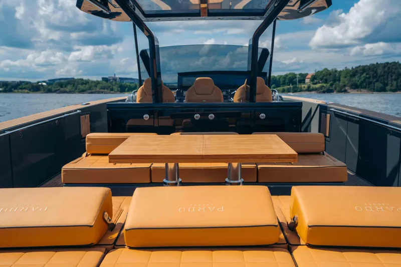  Yacht Photos Pics 2024 Pardo Yachts P43 luxury yacht interior with tan seating and wooden table.