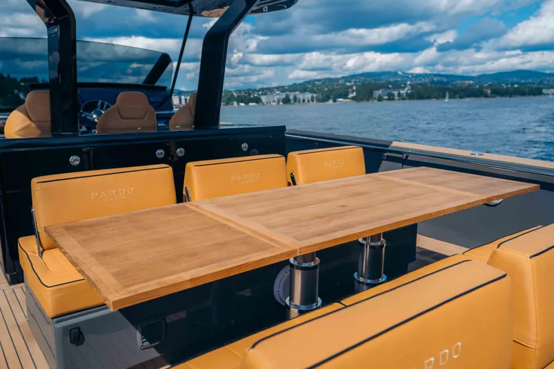  Yacht Photos Pics 2024 Pardo Yachts P43 luxury yacht with elegant seating and wooden table on deck.