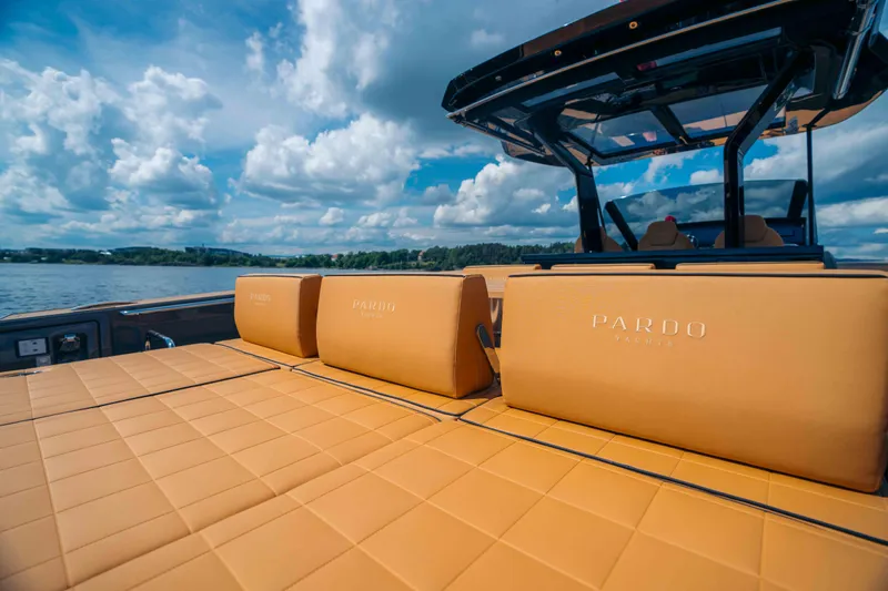 Yacht Photos Pics 2024 Pardo Yachts P43 with luxurious tan seating, set against a scenic water backdrop.