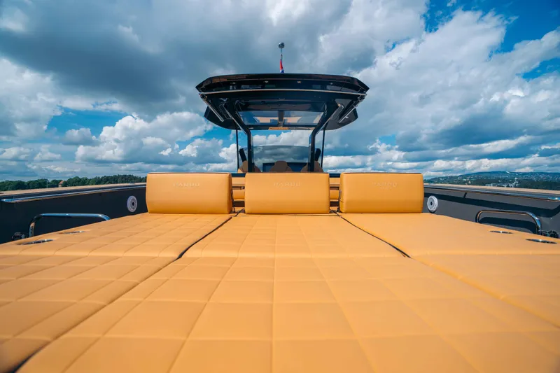  Yacht Photos Pics 2024 Pardo Yachts P43 with luxurious deck seating under a partly cloudy sky.