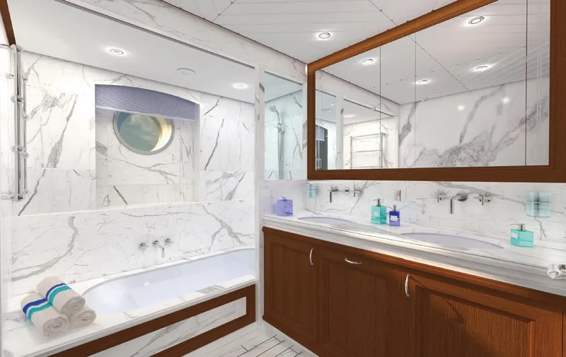 Simon Fraser Yacht Photos Pics Luxurious bathroom in 2026 Benetti 80 yacht with marble finishes and wooden cabinetry.