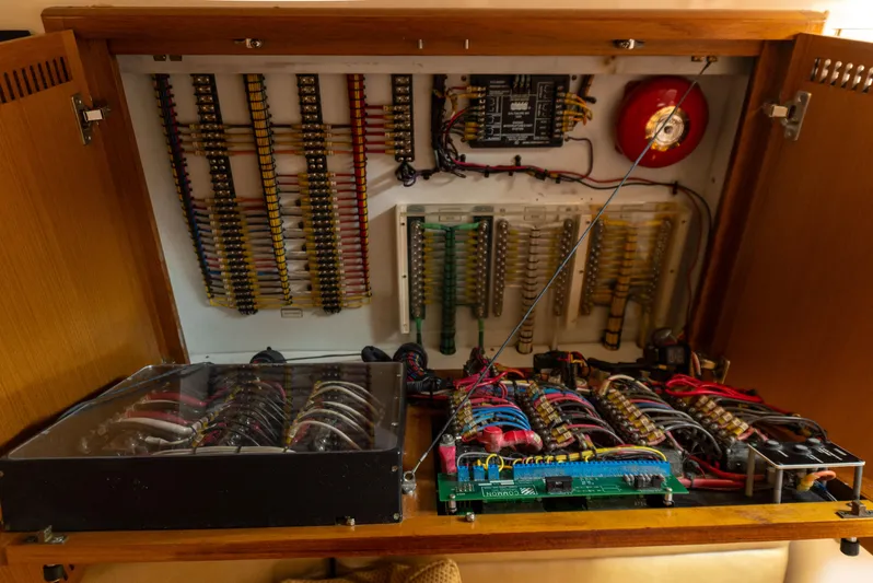 Miss Shell Yacht Photos Pics Electrical panel of a 2008 Cabo 38 Express boat with wiring and circuit boards.