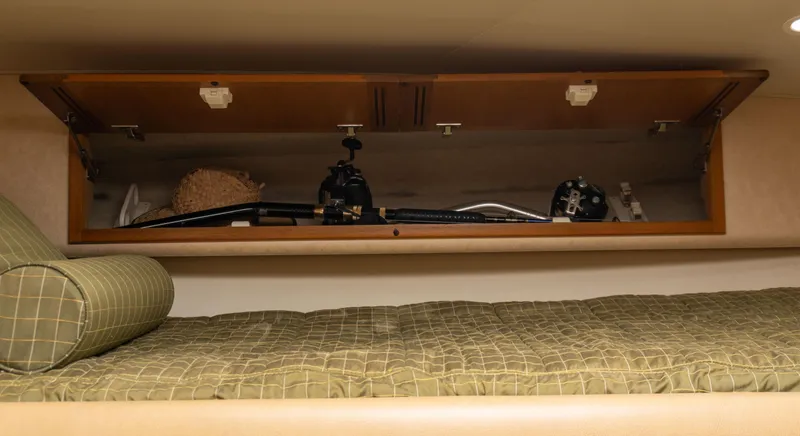 Miss Shell Yacht Photos Pics Storage compartment in 2008 Cabo 38 Express boat with fishing gear.