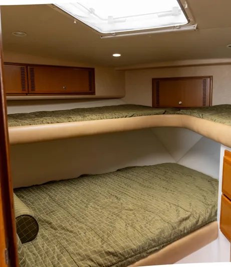 Miss Shell Yacht Photos Pics 2008 Cabo 38 Express boat interior with bunk beds and storage cabinets.