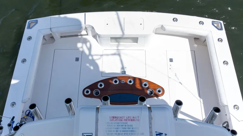 Miss Shell Yacht Photos Pics 2008 Cabo 38 Express boat deck with fishing rod holders and storage compartments.