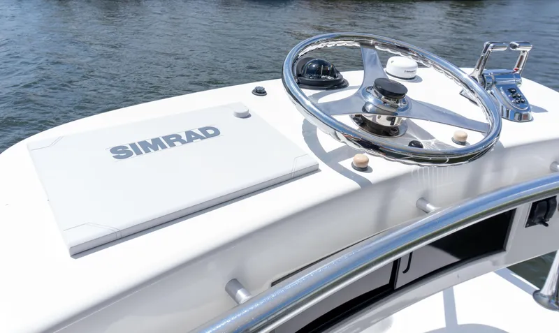 Miss Shell Yacht Photos Pics Helm of 2008 Cabo 38 Express boat with Simrad navigation system.