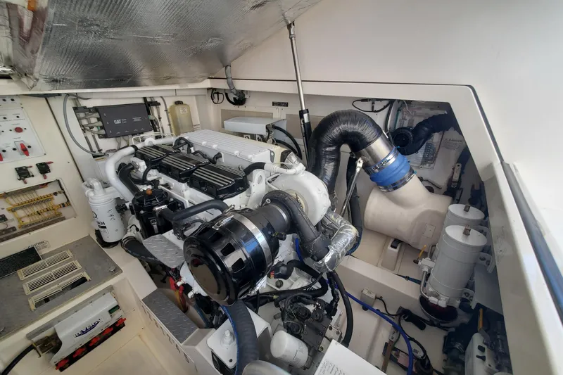 Miss Shell Yacht Photos Pics Engine room of a 2008 Cabo 38 Express boat with detailed components.
