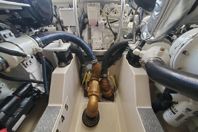 Miss Shell Yacht Photos Pics Engine room of a 2008 Cabo 38 Express boat with visible hoses and machinery.