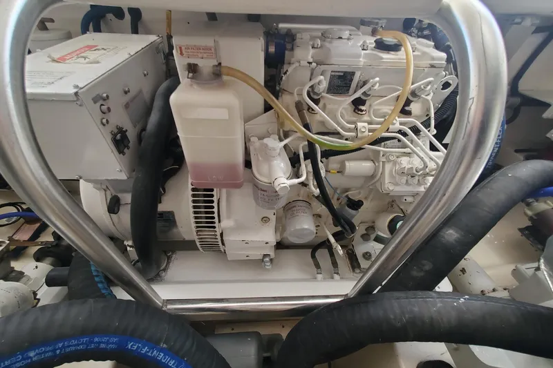 Miss Shell Yacht Photos Pics Engine compartment of a 2008 Cabo 38 Express boat with visible components and wiring.