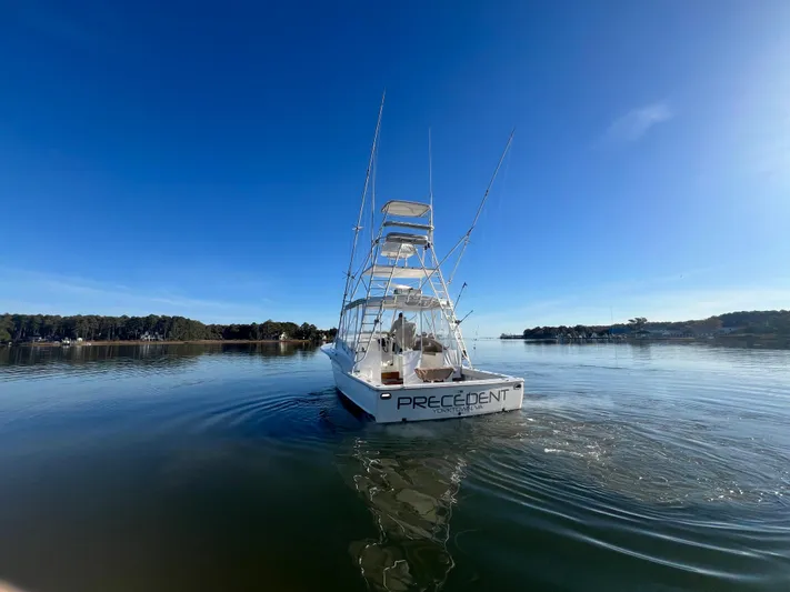 Precedent Yacht Photos Pics 1998 Jersey Cape 36 Express boat on calm water under clear blue sky.