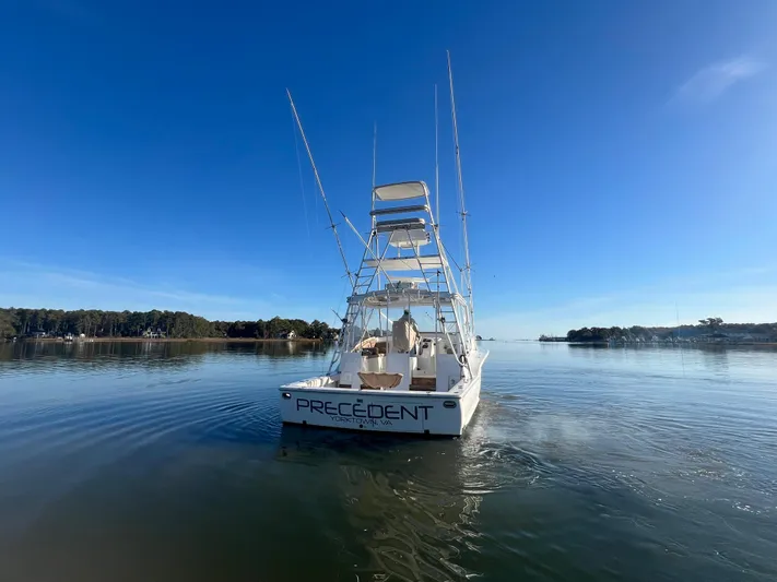 Precedent Yacht Photos Pics 1998 Jersey Cape 36 Express boat on calm water under clear blue sky.