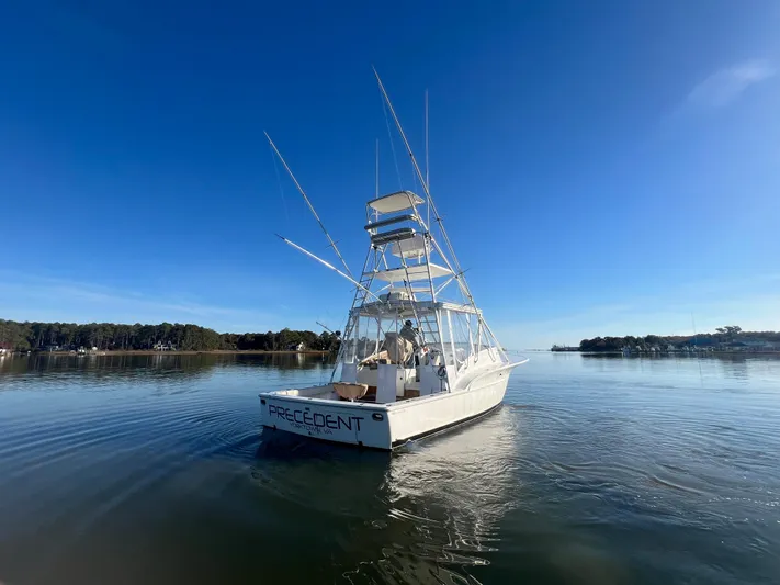 Precedent Yacht Photos Pics 1998 Jersey Cape 36 Express boat on calm water under clear blue sky.