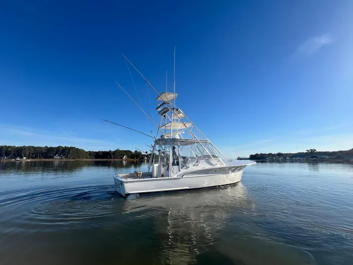 Precedent Yacht Photos Pics 1998 Jersey Cape 36 Express boat on calm water under clear blue sky.