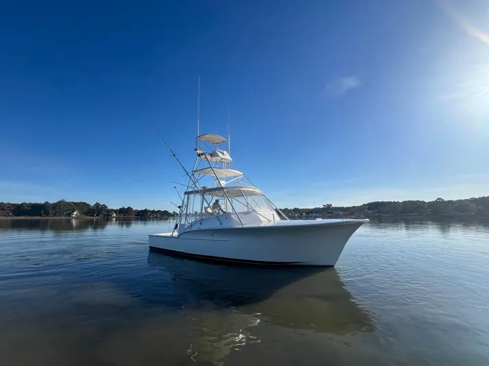 Precedent Yacht Photos Pics 1998 Jersey Cape 36 Express boat on calm water under clear blue sky.