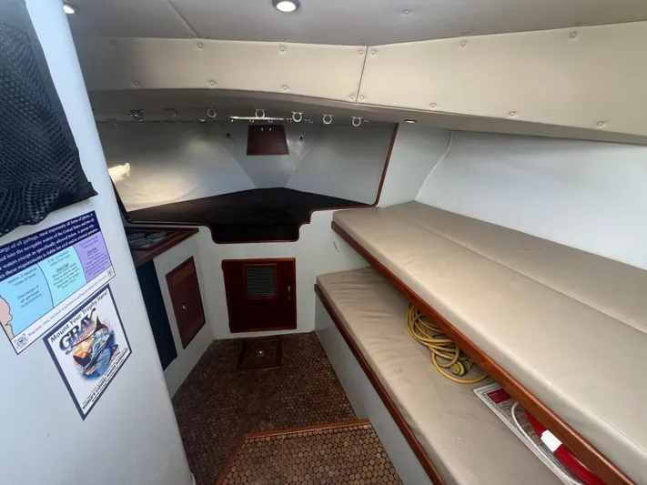 Precedent Yacht Photos Pics Interior of 1998 Jersey Cape 36 Express boat with seating and storage.