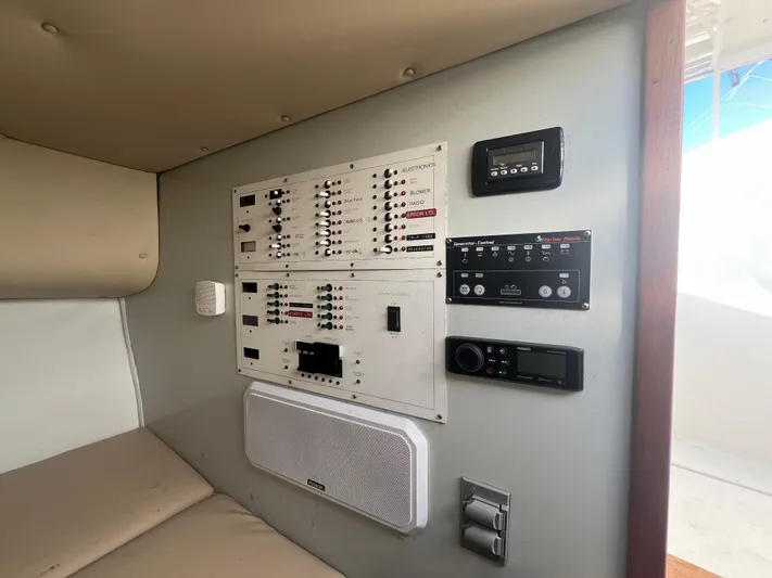 Precedent Yacht Photos Pics Control panel inside 1998 Jersey Cape 36 Express boat, featuring various electronic switches and controls.