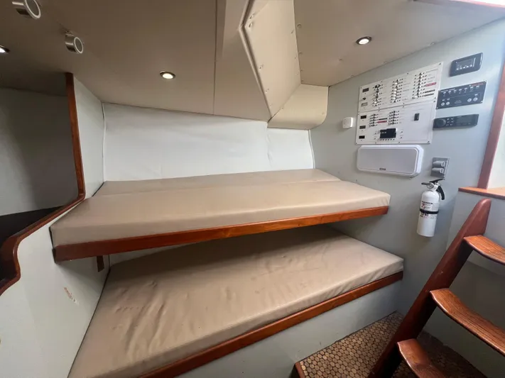 Precedent Yacht Photos Pics Interior of 1998 Jersey Cape 36 Express with bunk beds and control panel.