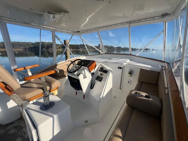 Precedent Yacht Photos Pics 1998 Jersey Cape 36 Express boat interior with helm, seating, and panoramic water view.