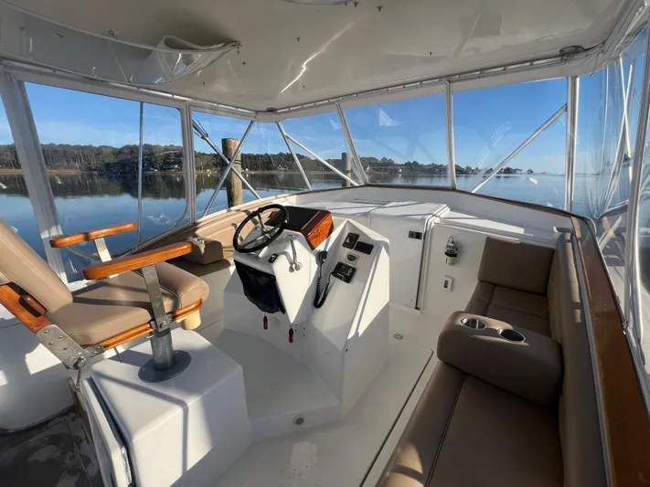 Precedent Yacht Photos Pics 1998 Jersey Cape 36 Express boat interior with helm, seating, and panoramic windows.