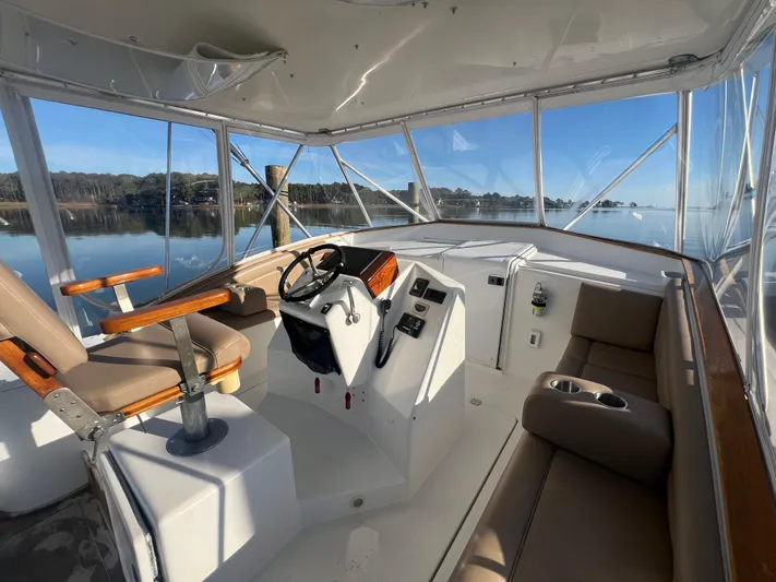 Precedent Yacht Photos Pics Interior of 1998 Jersey Cape 36 Express boat with helm and seating area.