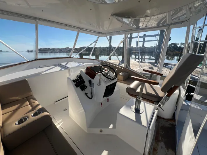 Precedent Yacht Photos Pics 1998 Jersey Cape 36 Express boat interior with helm, seating, and panoramic windows.