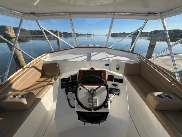 Precedent Yacht Photos Pics Interior view of 1998 Jersey Cape 36 Express boat helm with seating and controls.