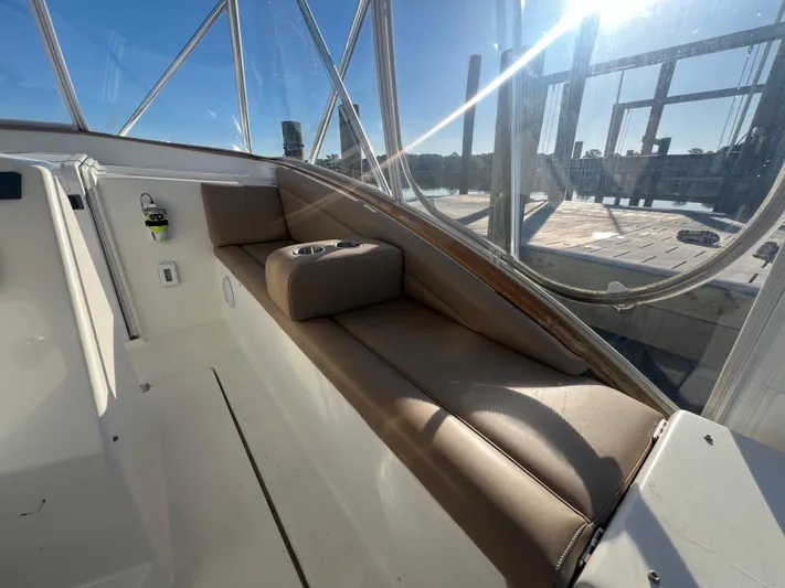 Precedent Yacht Photos Pics 1998 Jersey Cape 36 Express boat interior with cushioned seating and cup holders.