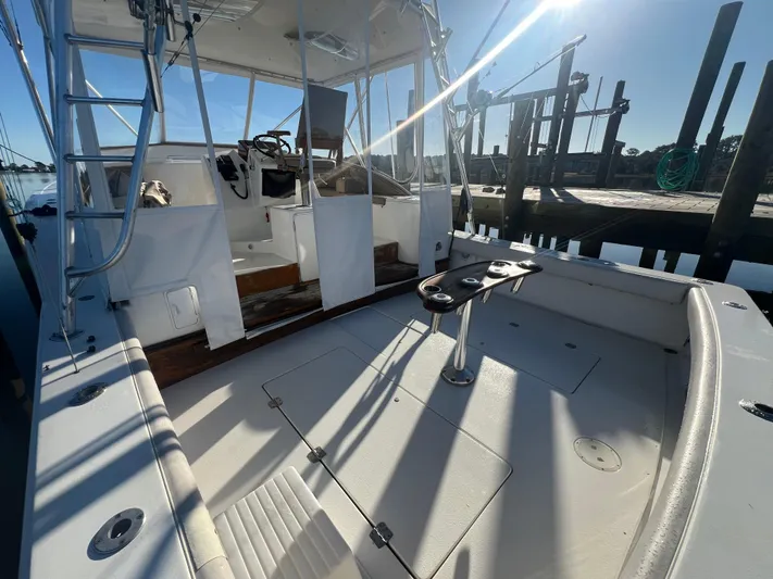 Precedent Yacht Photos Pics 1998 Jersey Cape 36 Express boat interior with fishing rod holders and helm station.