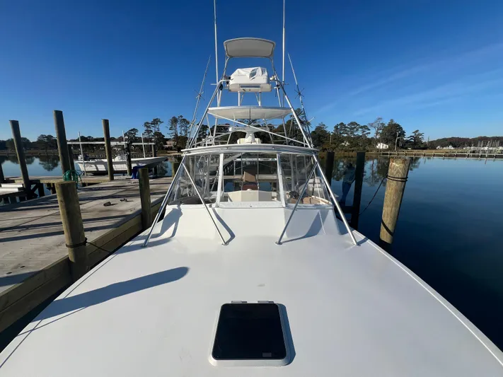 Precedent Yacht Photos Pics 1998 Jersey Cape 36 Express boat docked on a calm, sunny day.