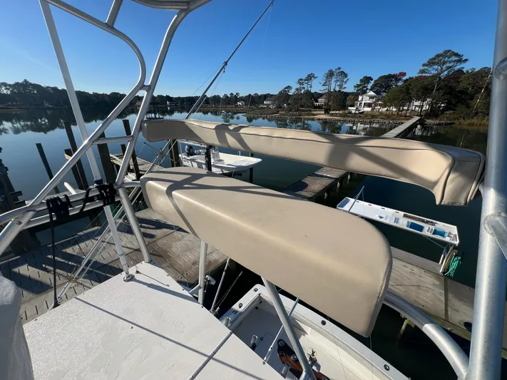 Precedent Yacht Photos Pics 1998 Jersey Cape 36 Express boat docked, featuring a flybridge with beige seating.