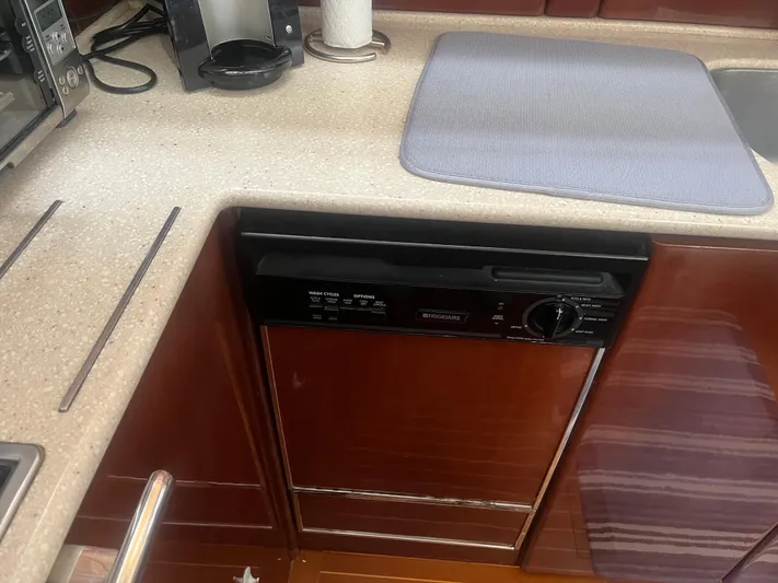 C Glass Yacht Photos Pics Kitchen area of a 2000 Princess 65 M/Y yacht with Frigidaire dishwasher.