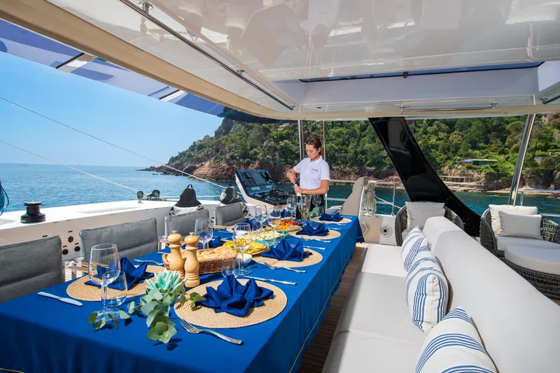 Endless Horizon II Yacht Photos Pics Luxurious Sunreef 80 Sail yacht dining setup with ocean view, 2022 model.