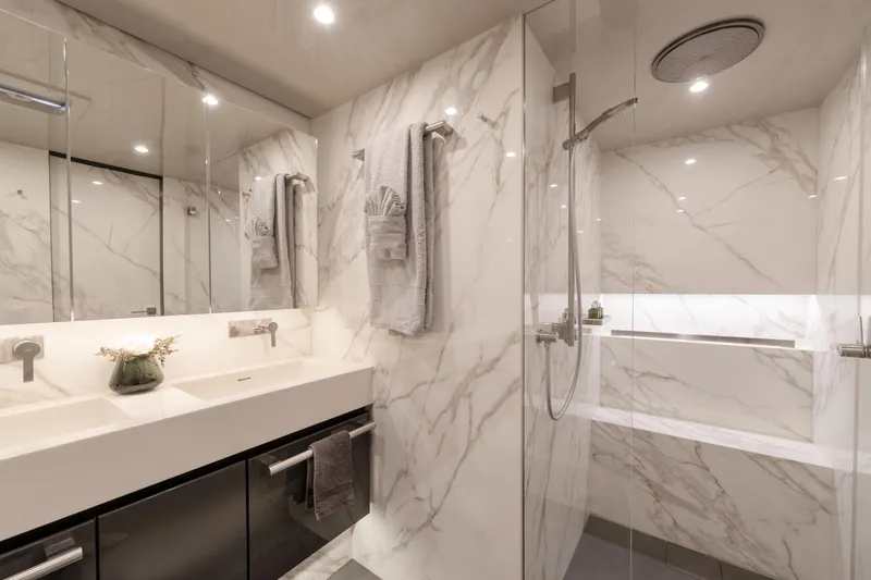 Endless Horizon II Yacht Photos Pics Luxurious marble bathroom in 2022 Sunreef 80 Sail yacht with modern fixtures and elegant design.