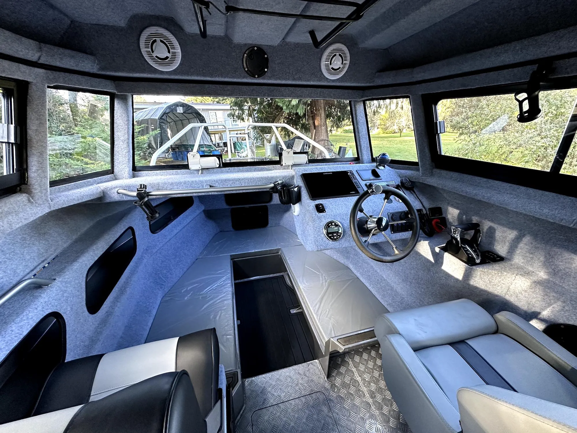 Interior of 2023 Custom Ocean King boat, featuring modern dashboard and seating.