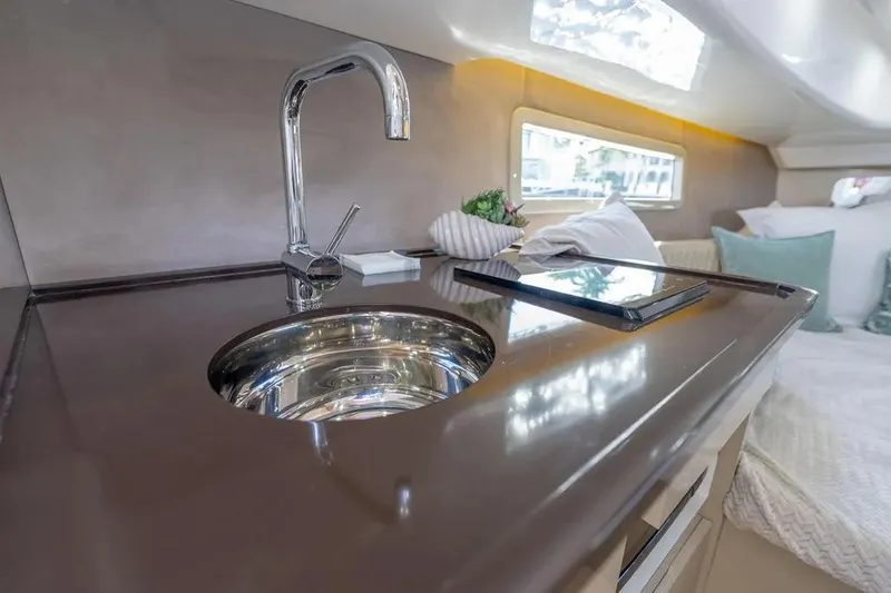  Yacht Photos Pics Luxurious interior of 2025 Hanover 347 yacht featuring sleek kitchen sink and modern design.