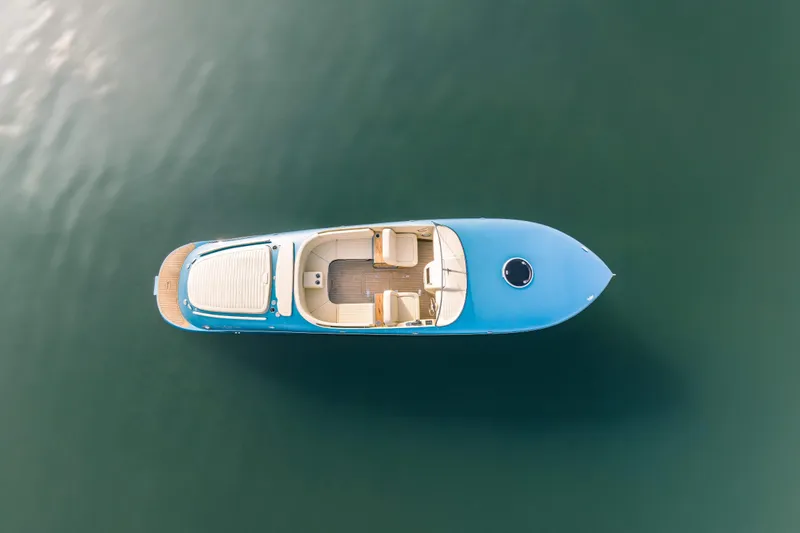  Yacht Photos Pics Overhead view of 2025 Seven Seas Yachts Venus Speedster X, 32ft, on calm water.