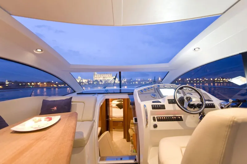  Yacht Photos Pics Interior of 2009 Prestige 38S yacht with modern helm and cityscape view.