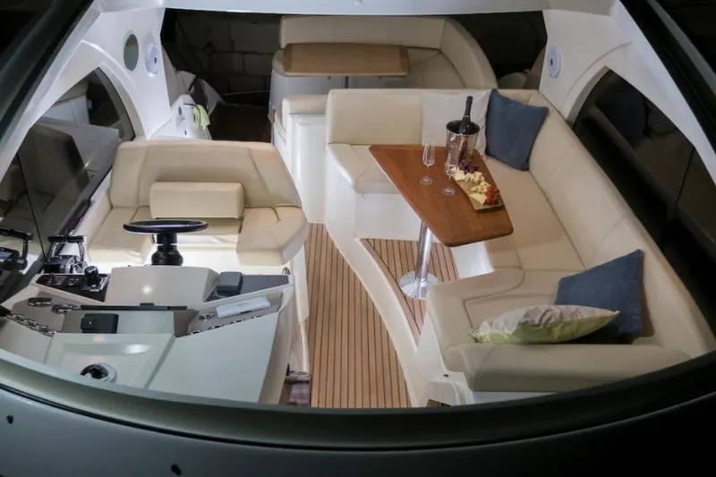  Yacht Photos Pics Luxurious interior of a 2009 Prestige 38S yacht with elegant seating and dining area.