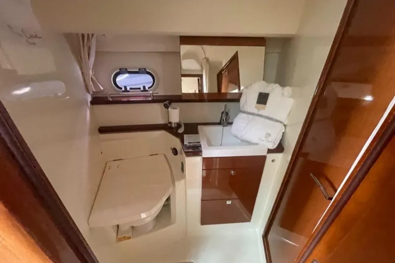  Yacht Photos Pics Luxurious bathroom interior of 2009 Prestige 38S yacht with sink and mirror.