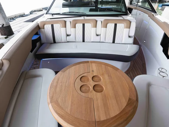  Yacht Photos Pics Luxurious 2019 Sea Ray SLX 400 boat interior with elegant seating and wooden table.
