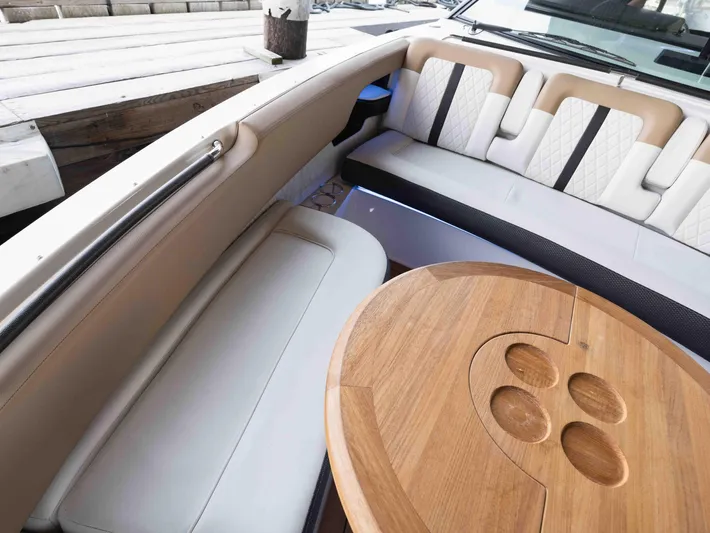  Yacht Photos Pics Luxurious seating area on a 2019 Sea Ray SLX 400 boat with wooden table.