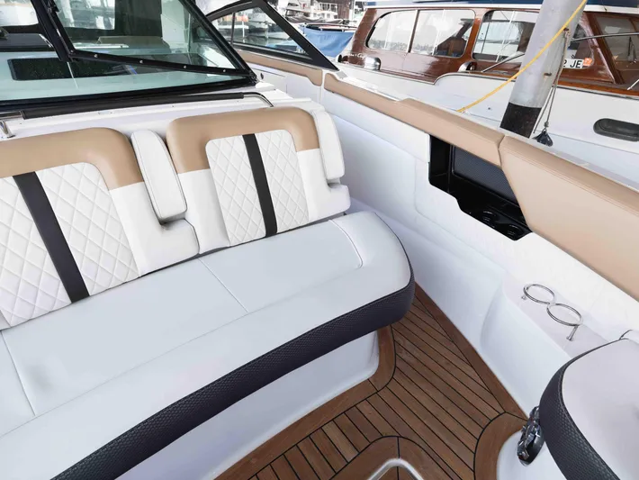  Yacht Photos Pics Luxurious interior of 2019 Sea Ray SLX 400 boat with elegant seating and wood flooring.