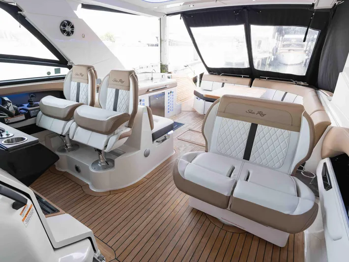  Yacht Photos Pics Luxurious interior of 2019 Sea Ray SLX 400 boat with elegant seating and wood flooring.