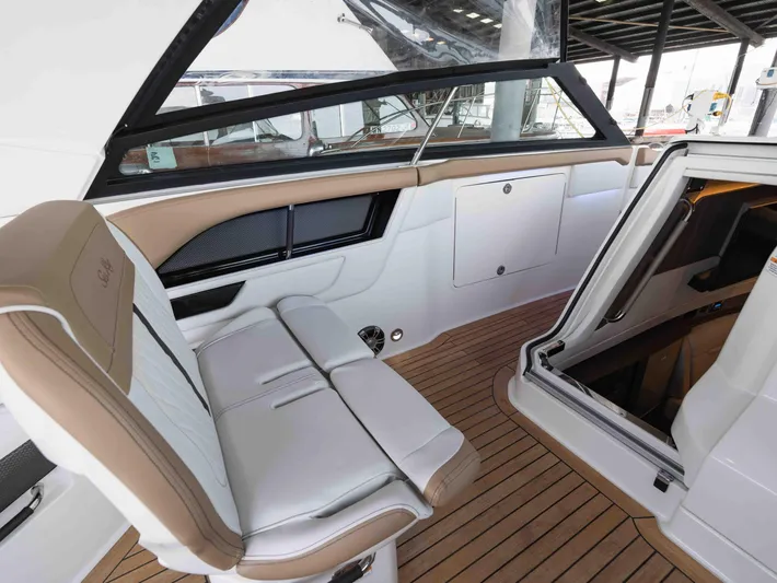  Yacht Photos Pics 2019 Sea Ray SLX 400 interior with white and tan seating, wooden flooring.